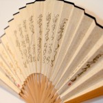 Shi Jinsong, Writing on the Wall / Writing on Fans, live performance, writing with charcoal on an insignificant wall and on paper fans, 2012
