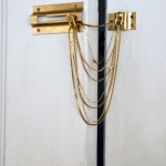 Magdalen Wong, "Chains 2," safety door chain, lock and old necklaces, dimensions variable, 2010