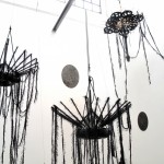 Ed Pien and Karin van Dam, "Suspended Gravity," mixed media installation, acrylic, wool, sand bags, boat fenders, Chinese umbrellas, gear shift boot, styrofoam, plastic ties, embroidery rings, string, dimensions variable, 2013 