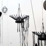 Ed Pien and Karin van Dam, "Suspended Gravity," mixed media installation, acrylic, wool, sand bags, boat fenders, Chinese umbrellas, gear shift boot, styrofoam, plastic ties, embroidery rings, string, dimensions variable, 2013 